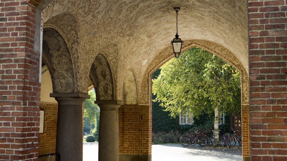 Gender Studies brick archway in a sunny day.